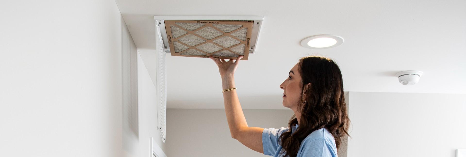 lady changing air filter